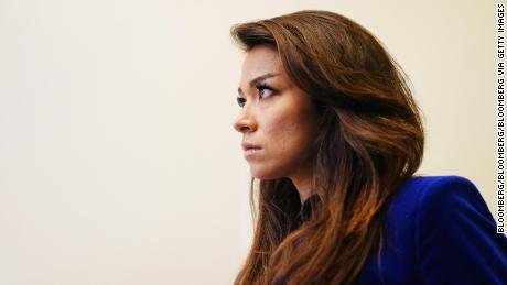 Chanel Rion listens as U.S President Donald Trump speaks during a news conference at the White House. (Jim Lo Scalzo/EPA/Bloomberg via Getty Images)