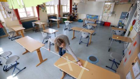 Staff tape off social-distancing markings during preparations for reopening the temporarily-closed Schloss-Schule elementary school on April 21, 2020 in Heppenheim, Germany. 