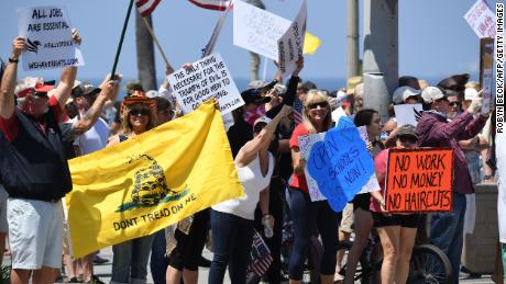 Large crowds in Huntington Beach protest beach closures by California governor