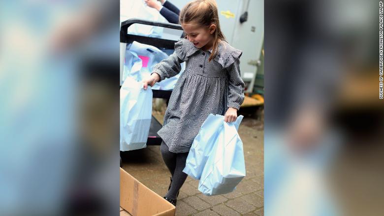 The young royal helped her family pack and deliver food.