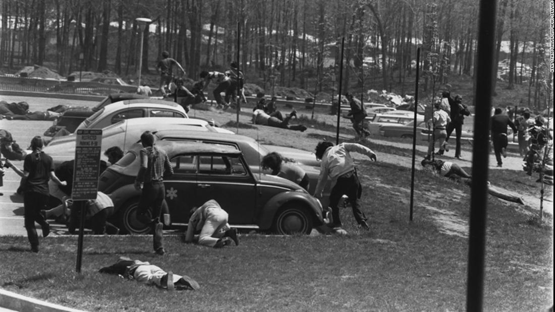 Students run for cover after the National Guard opened fire. Twenty-eight guardsmen fired into the crowd for 13 seconds, wounding nine students and killing 4.