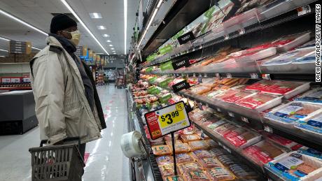 WASHINGTON, DC - APRIL 28: A man shops in the meat section at a grocery store, April 28, 2020 Washington, DC. Meat industry experts say that beef, chicken and pork could become scarce in the United States because many meat processing plants have been temporarily closed down due to the coronavirus pandemic. Tyson Foods took out a full page advertisement over the weekend in several major American newspapers, warning that the food supply chain is on the cusp of breaking. (Photo by Drew Angerer/Getty Images)