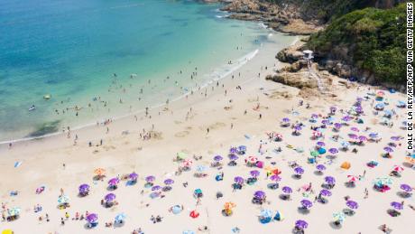 People at a beach in Hong Kong on April 19.