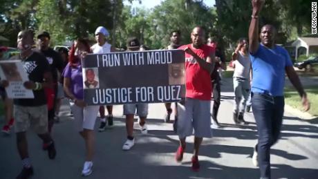 Protesters chant, &quot;I run with Maud&quot; Tuesday in the Satilla Shores, where Arbery was killed. 