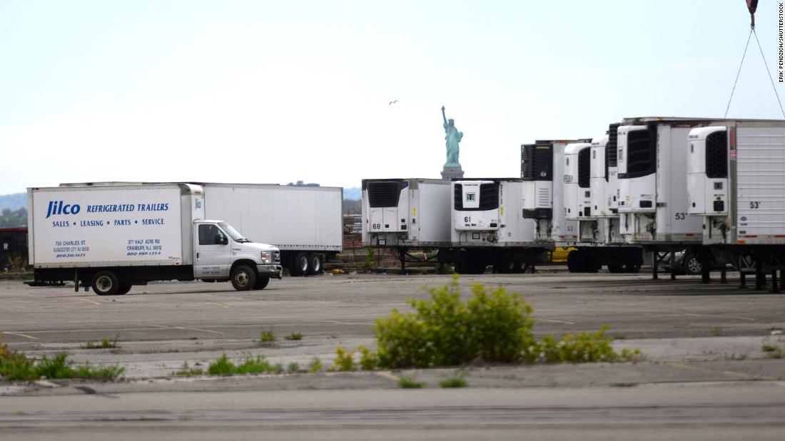 Refrigerated trucks are seen at a morgue that opened in New York to assist overwhelmed funeral homes.