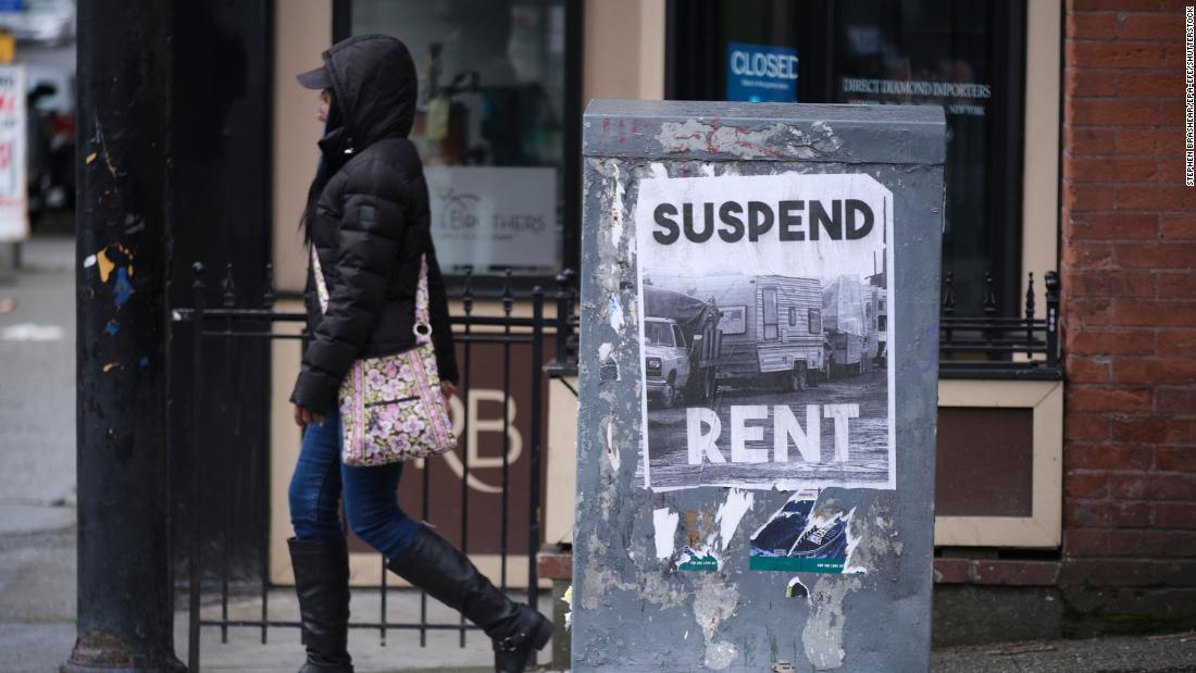 A sign in downtown Seattle, pictured in March, calls for the suspension of rent during the pandemic.