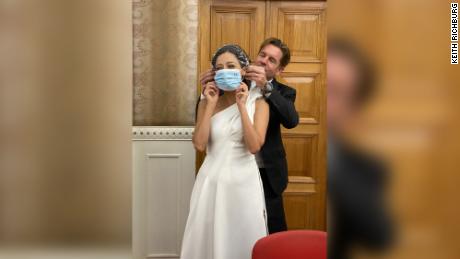 Ivan puts a surgical mask on new bride Rana. Photo: Keith Richburg 