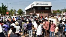 A crowd gathers outside the plant  after the leak.