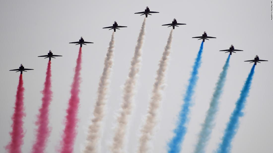 The Red Arrows, officially known as the Royal Air Force Aerobatic Team, fly over London.