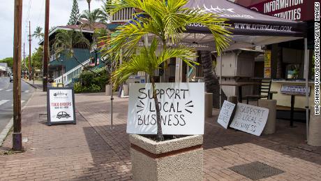 &quot;Support Local Business&quot; signs are posted along Front Street in Lahaina, Hawaii, on Friday.