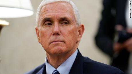 Vice President Mike Pence listens as President Donald Trump holds a meeting about the coronavirus response with Gov. Greg Abbott, R-Texas, in the Oval Office of the White House, Thursday, May 7, 2020, in Washington. (AP Photo/Evan Vucci)