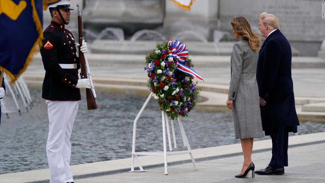 US President Donald Trump and first lady Melania Trump participate in a wreath-laying ceremony at the World War II Memorial in Washington.