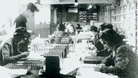 One of the Hut 3 priority teams at Bletchley Park, Buckinghamshire, where civilian and service personnel worked together at code-breaking. 