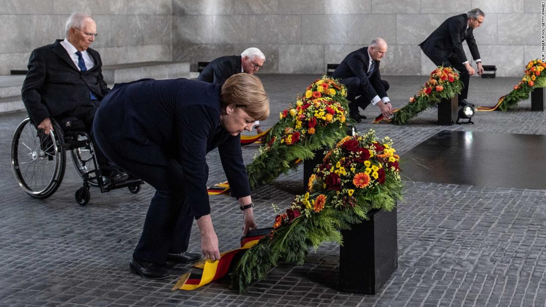 German Chancellor Angela Merkel attends a wreath-laying ceremony at the Neue Wache Memorial in Berlin.