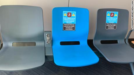 Social distancing was encouraged at Istanbul&#39;s airport with signs on seats,