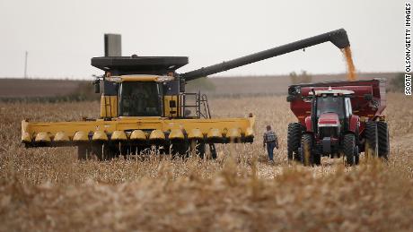 Workers harvesting a field of corn in South Dakota.