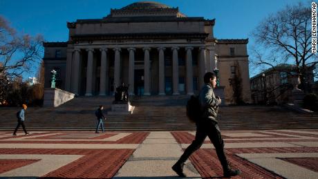 A man walks on the Columbia University campus on March 9. Colleges nationwide shut down campuses and continue with classes online as the coronavirus pandemic grew. 