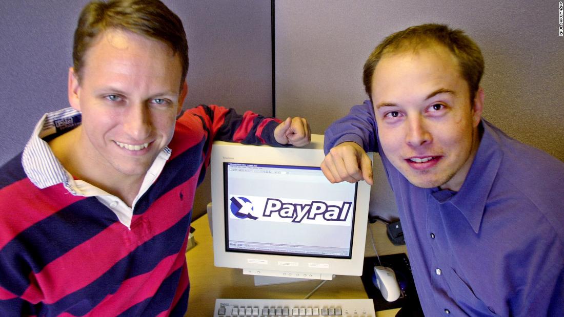 PayPal CEO Peter Thiel, left, and Musk pose at the company&#39;s corporate headquarters in Palo Alto, California, in 2000. Musk had co-founded X.com, an online banking and financial services company. It merged with Continuity in 2000 and was renamed PayPal. The online payment platform was acquired by eBay in a $1.5 billion deal in 2002. Musk pocketed $165 million.