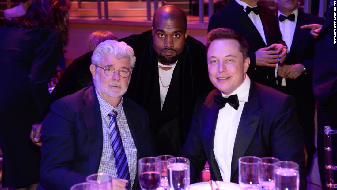 Musk attends the Time 100 Gala with filmmaker George Lucas, left, and rapper Kanye West in 2015.