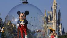 397155 06: Mickey Mouse rides in a parade through Main Street, USA with Cinderella&#39;s castle in the background at Disney World&#39;s Magic Kingdom November 11, 2001 in Orlando, Florida. (Photo by Joe Raedle/Getty Images)