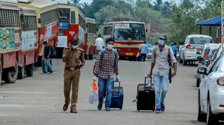 Indian citizens evacuated from Maldives arrive at the Cochin port in Kochi in the south Indian state of Kerala on May 10, 2020. 