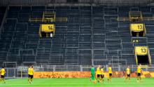 Borussia Dortmund&#39;s game against local rival Schalke 04 was played with no fans as soccer returned. 