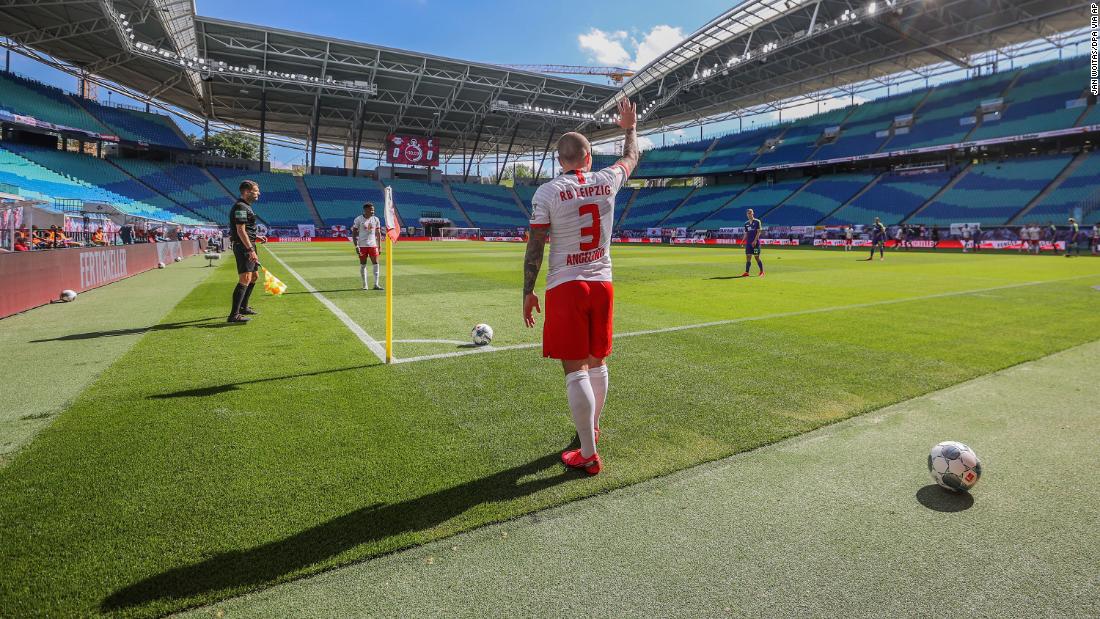 Angelino, a professional soccer player with the German club RB Leipzig, takes a corner kick during a Bundesliga match against Freiburg on May 16, 2020. The stadium was nearly empty, as &lt;a href=&quot;https://www.cnn.com/2020/05/15/football/bundesliga-return-soccer-safety-spt-intl/index.html&quot; target=&quot;_blank&quot;&gt;no more than 322 people&lt;/a&gt; were able to attend each Bundesliga match until the end of the season. 