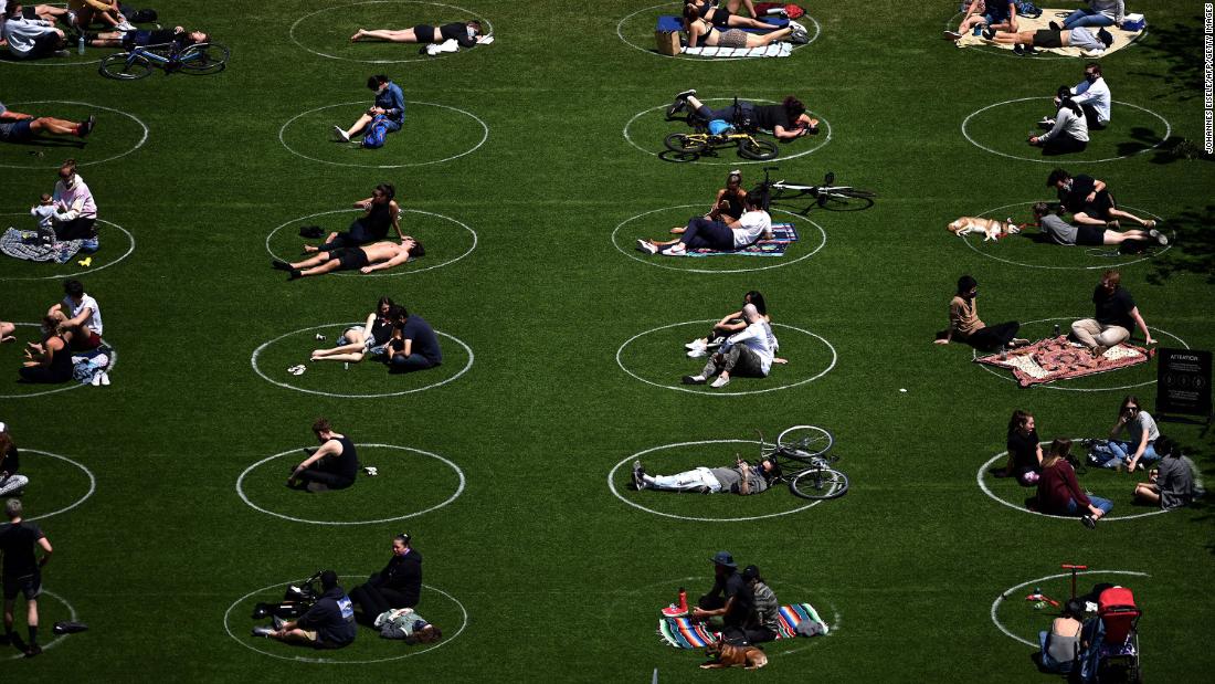 People practice social distancing in New York&#39;s Domino Park on May 17, 2020.