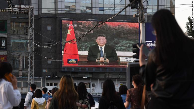 A news program shows Chinese President Xi Jinping speaking via video link to the World Health Assembly on Monday.