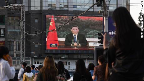 A news program shows Chinese President Xi Jinping speaking via video link to the World Health Assembly on Monday.