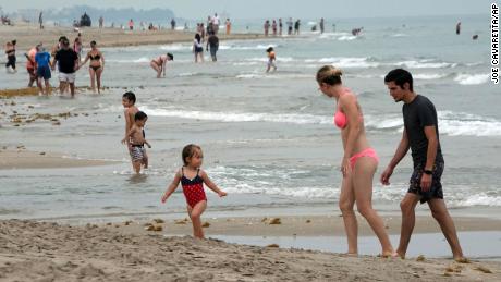 Social distancing rules are in effect in Delray Beach, Fla., as the beaches reopened Monday, May 18, 2020, as part of the Palm Beach County Beach reopening. Police and lifeguards were enforcing social distancing. (Joe Cavaretta/South Florida Sun-Sentinel via AP)