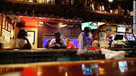 People wait at the bar of a restaurant as the coronavirus disease outbreak continues, in Atlanta, Georgia, U.S., May 15, 2020.