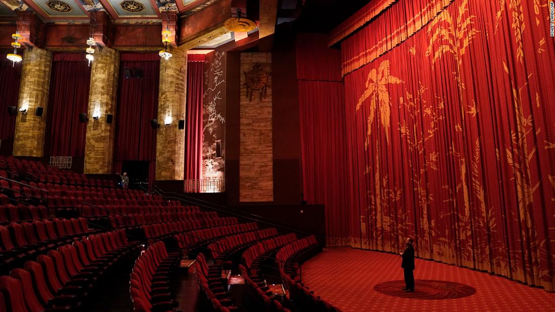 Levi Tinker, resident historian and general manager of the TCL Chinese Theatre in Hollywood, makes an announcement inside the theater&#39;s empty auditorium on May 18, 2020. It was the theater&#39;s 93rd birthday celebration.