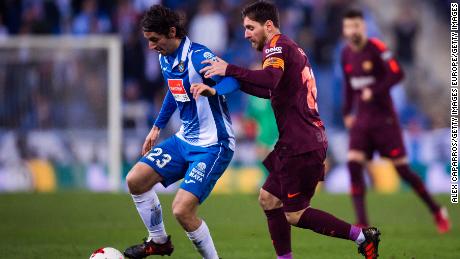 Lionel Messi tries to tackle Granero during Barcelona&#39;s La Liga clash against Espanyol in 2018.