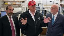 President Donald Trump speaks next to US Health and Human Service Secretary Alex Azar and CDC Director Robert Redfield during a tour of the Centers for Disease Control and Prevention on March 6, 2020. 