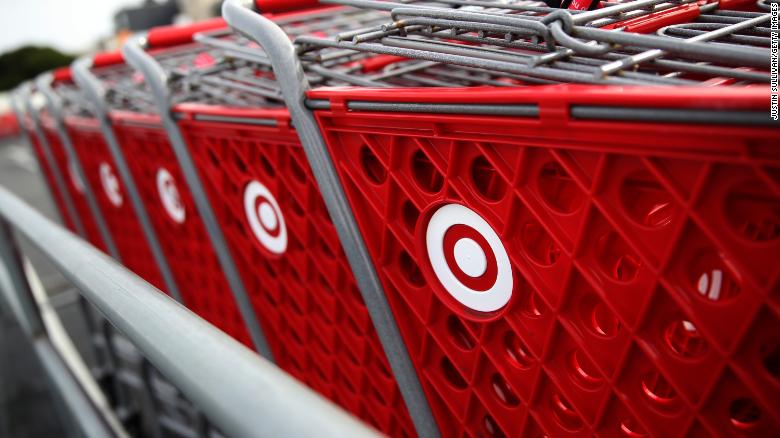 The Target logo is displayed on shopping carts outside of a Target store on January 15, 2020 in San Francisco, California. Shares of big box retailer Target fell after the company reported that same-store sales during November and December inched up only 1.4%, compared to a more robust growth of 5.7% one year ago. (Photo by Justin Sullivan/Getty Images)