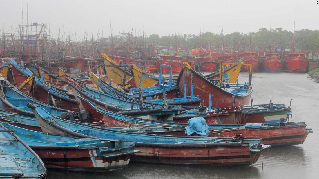 Boats are anchored at a fishing harbor in Paradeep.