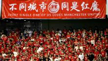 Suporterii se înveselesc în timpul meciului din Cupa Campionilor Internaționali dintre Tottenham și United pe stadionul Shanghai Hongkou din Shanghai, China, anul trecut.