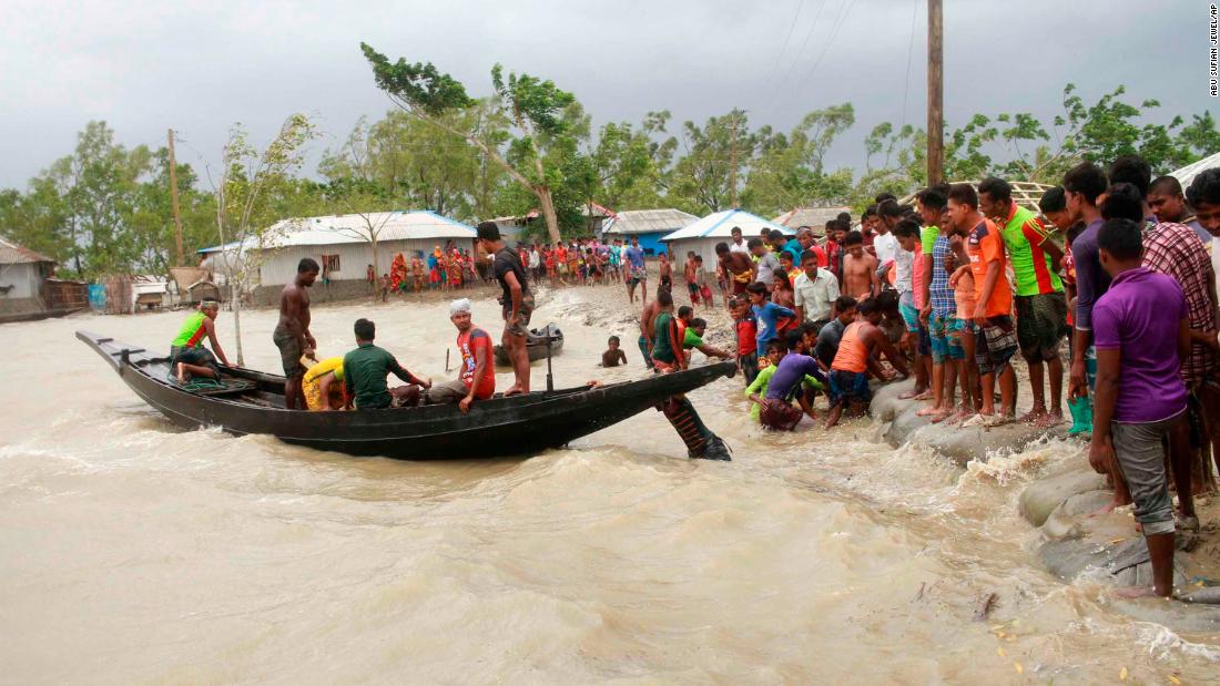 A boat ferries people to dry land in Shyamnagar on May 20.