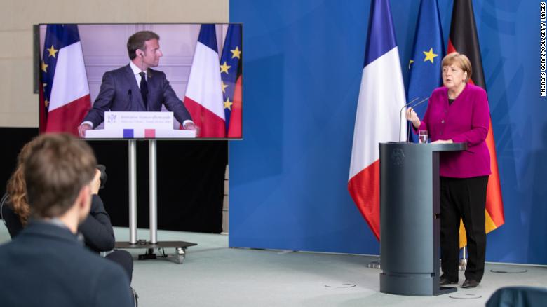 German Chancellor Angela Merkel and French President Emmanuel Macron speak to reporters in Berlin on Monday, May 18.