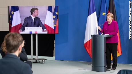 German Chancellor Angela Merkel and French President Emmanuel Macron speak to reporters in Berlin on Monday, May 18.