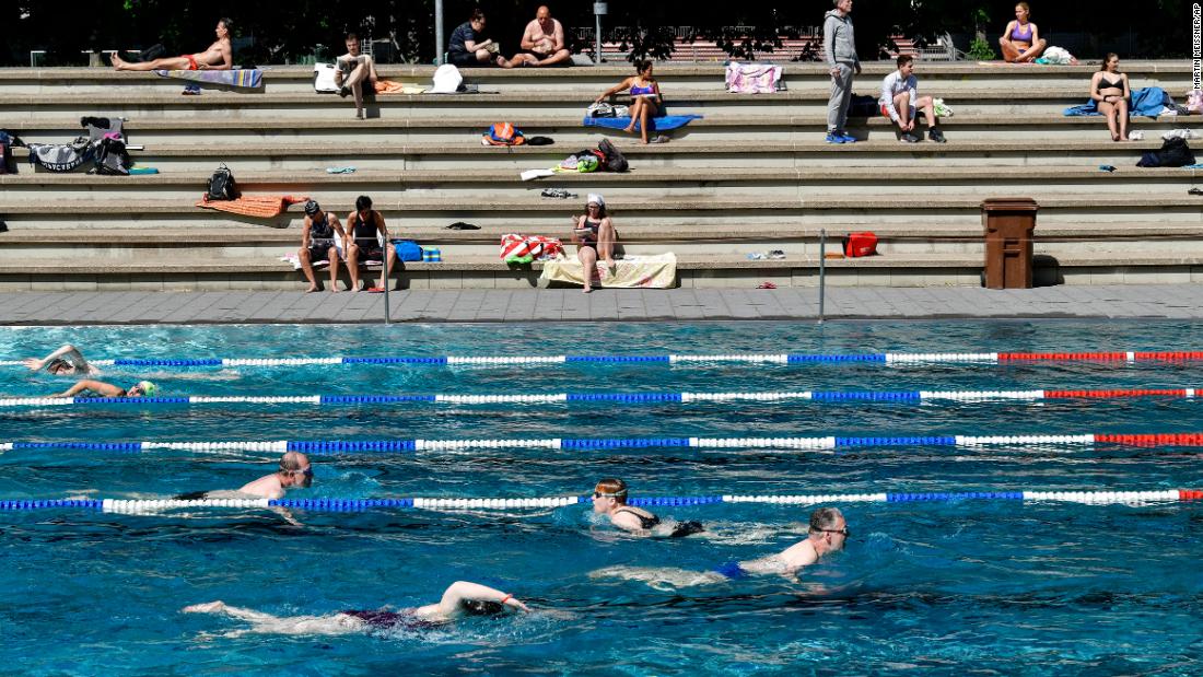 People swim at a public pool in Cologne, Germany, on May 21.