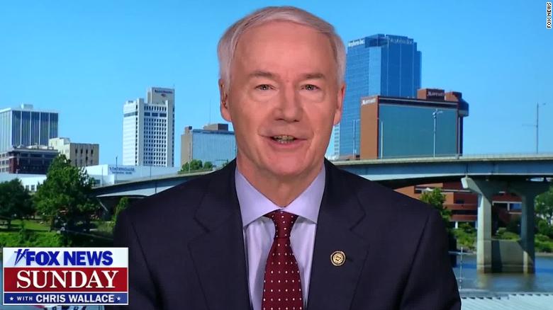 Arkansas governor defends reopening amid second peak