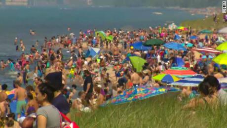 Photos show plenty of people flocked to beaches, but not a lot of social distancing or masks