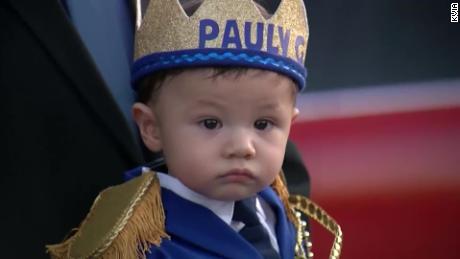 Hundreds took part in a parade celebrating the first birthday of a boy who lost both his parents in the El Paso shooting 