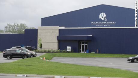 A parking lot is nearly empty in front of the Indianapolis Colts training facility on May 19 in Indianapolis. Coaching staffs and all players except those undergoing injury rehabilitation are barred from the facilities in the first phase of the league&#39;s plan. 