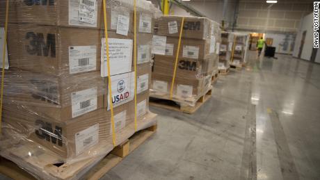 Boxes of personal protective equipment (PPE) is delivered to a warehouse to be distributed by the Oregon Army National Guard. The shipment was coordinated by FEMA to deliver supplies stored in Dubai by USAID.