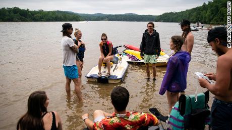People hang out on a sandbar on Lake Tillery Monday in Mount Gilead, North Carolina. 
