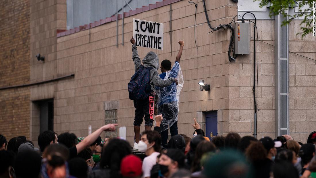 Hundreds gather where George Floyd was pinned by police