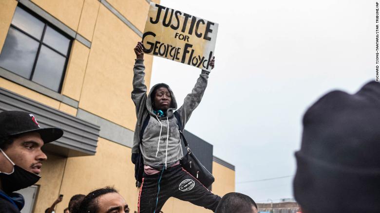 Protesters gather Tuesday, May 26, near the Minneapolis Police 3rd Precinct in response to the death in police custody of George Floyd.